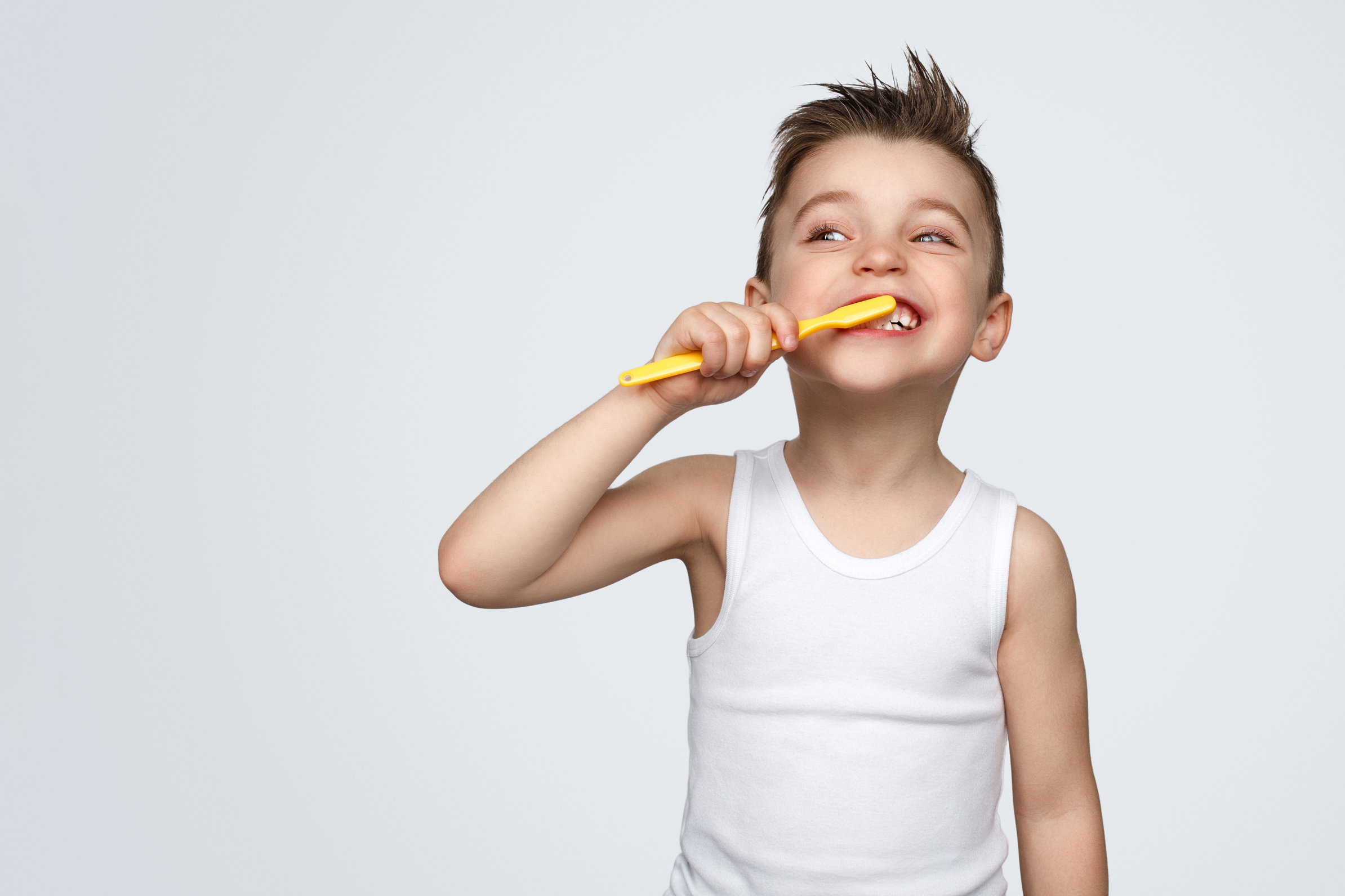 Adorable kid brushing teeth